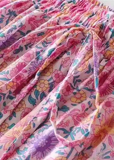 Pink boho ruffled maxi skirt with floral pattern