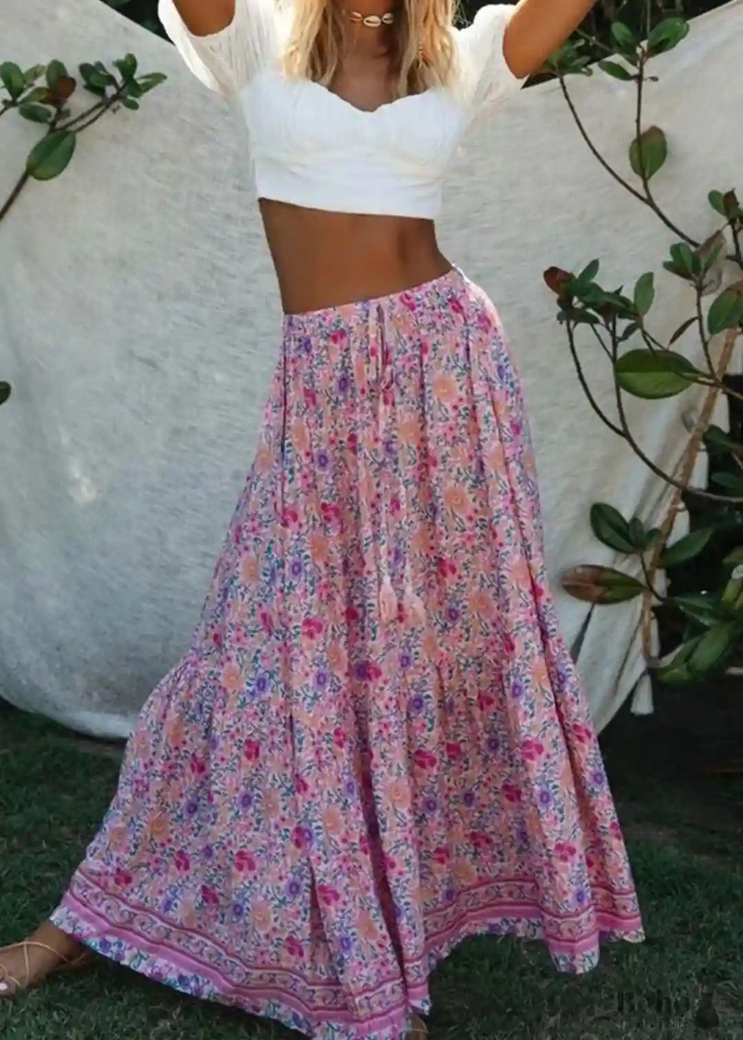 Pink boho ruffled maxi skirt with floral pattern