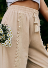 Boho khaki cotton pants with wide legs pompom pattern