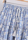 Boho mini wrap skirt, sky blue floral pattern with pompom