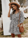 Hippie chic white dress with floral-style patterns